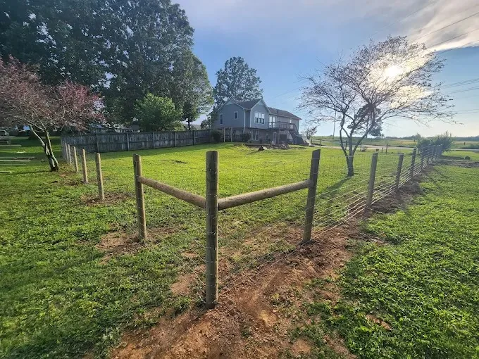 Wire farm fence with wood posts on a Maury County, TN property